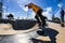 Beautiful shot of a young skateboarder doing some tricks at Alex Skate Park in Australia