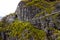 Beautiful side view from the top of via ferrata Loen Norway with suspension bridge and walking man in autumn