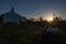 Beautiful silhouette of chapel and cross in sunrise on atlantic coast in bidart, basque country