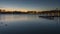 Beautiful silhouette of evening Hanover and huge artificial lake Maschsee. Germany. Time lapse.