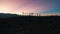 Beautiful silhouette of a person clicking pictures during sunset in spiti valley , himachal pradesh , prayer flags, blue