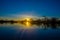 Beautiful silhouetted against an orange sky at sunset over Laguna Grande in the Cuyabeno National Park, in Ecuador