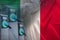 Beautiful silk banner, national flag of Italy, replenish battery charging station for electric car, alternative energy development