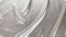 Beautiful silk fabric of white color, draped with small folds, softly flowing, luxury, wedding concept, texture, background, form