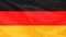 Beautiful silk German flag draped with small folds, gently flowing, concept of public policy, economy, tourism, copy space
