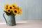 Beautiful silk sunflowers in blue antique watering can