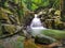 Beautiful silky smooth waterfall stream in the rainforest Sabah, Malaysia.