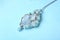 Beautiful silver necklace with pure quartz gemstones on blue background