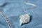 Beautiful silver pendent with pure quartz gemstones on blue fabric