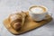 Beautiful and simple traditional French breakfast of fresh croissant and a cup of cappuccino