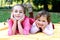 Beautiful sisters in the autumn park.