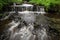 Beautiful Skanstupite waterfall. Photographed with long exposure.