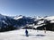 Beautiful ski panorama: Ski slope with ski lifts chairlifts and unidentifiable skiers