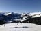 Beautiful ski panorama: Ski slope with ski lifts chairlifts and unidentifiable skiers