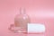 beautiful skin flat lay care pink serum liquid dropper minimal pink background