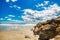 A beautiful sky, beach and rock on a groin at Pawleys Island.