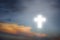 Beautiful sky .Beaming bright white cross in heaven . Glowing light cross