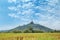 Beautiful sky, clouds with crop field and Buddha stute