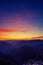 Beautiful sky and landscape after sunset with purple trail from passing airplane