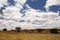 Beautiful sky over the wavy deforested landscape of northwest Madagascar