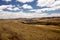 Beautiful sky over the wavy deforested landscape of northwest Madagascar