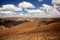 Beautiful sky over the wavy deforested landscape of northwest Madagascar