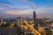 Beautiful sky after sunset, aerial view over city downtown and Bangkok main river