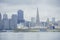 The beautiful skyline of San Francisco with a big cargo ship in