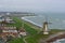 Beautiful skyline of the windmill of vlissingen with some houses and view at sea, typical dutch landscape, popular city in zeeland