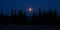 A beautiful skyscape with a moon in the dark skies. Springtime scenery before the dawn with moon.