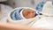 Beautiful sleeping baby Close-up portrait Dolly shot of the hand on a newborn baby face shallow depth of field