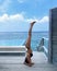 Beautiful slender woman in a swimsuit practicing yoga, Maldives, beautiful background, clean water, pool, sea and ocean