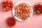 Beautiful slices of berries on a plate, whole and sliced pink strawberries close-up