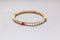 Beautiful slim gold and silver bracelet with shiny precious stones