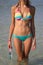 Beautiful slim woman body in bikini in sea water