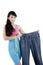 Beautiful slimming Asian woman showing her oversized old jeans