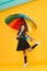 So beautiful. small girl colorful umbrella. bright autumn style. dancing on way to school. happy child protected rain