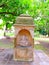 A beautiful small marble temple where is a deity in the garden, India