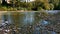 Beautiful small mountain river in Slovenia for kayaking. Autumn landscape.