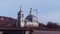 Beautiful small Orthodox Church on blue sky background. Stock footage. Beautiful old Catholic Church in totem style of