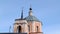 Beautiful small orthodox church on blue sky background. Stock footage. Beautiful old catholic church in totem style of