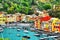 The beautiful small village Portofino with colorfull houses, luxury boats and yacht in little bay harbor.