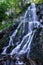 Beautiful small waterfall in Alsace forest