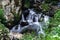 Beautiful small waterfall in Alsace forest