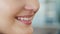 Beautiful smile with whitening teeth. Dental photo. Macro closeup of perfect female mouth, lipscare rutine. Happy