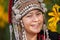 Beautiful smile young hill tribe girl in sunflowers garden.