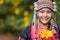 Beautiful smile young hill tribe girl in sunflowers garden.