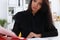 Beautiful smiling brunette woman sit at table