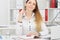 Beautiful smiling business woman sitting at office workplace looking in camera portrait.