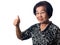 Beautiful smiling elderly asian woman raises her thumb up standing on white background. Gesture everything is okay